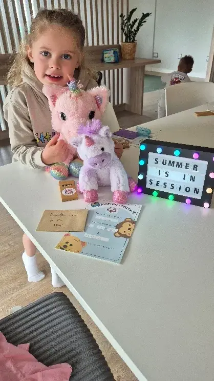 Child celebrating with her Little Lotus workshop craft